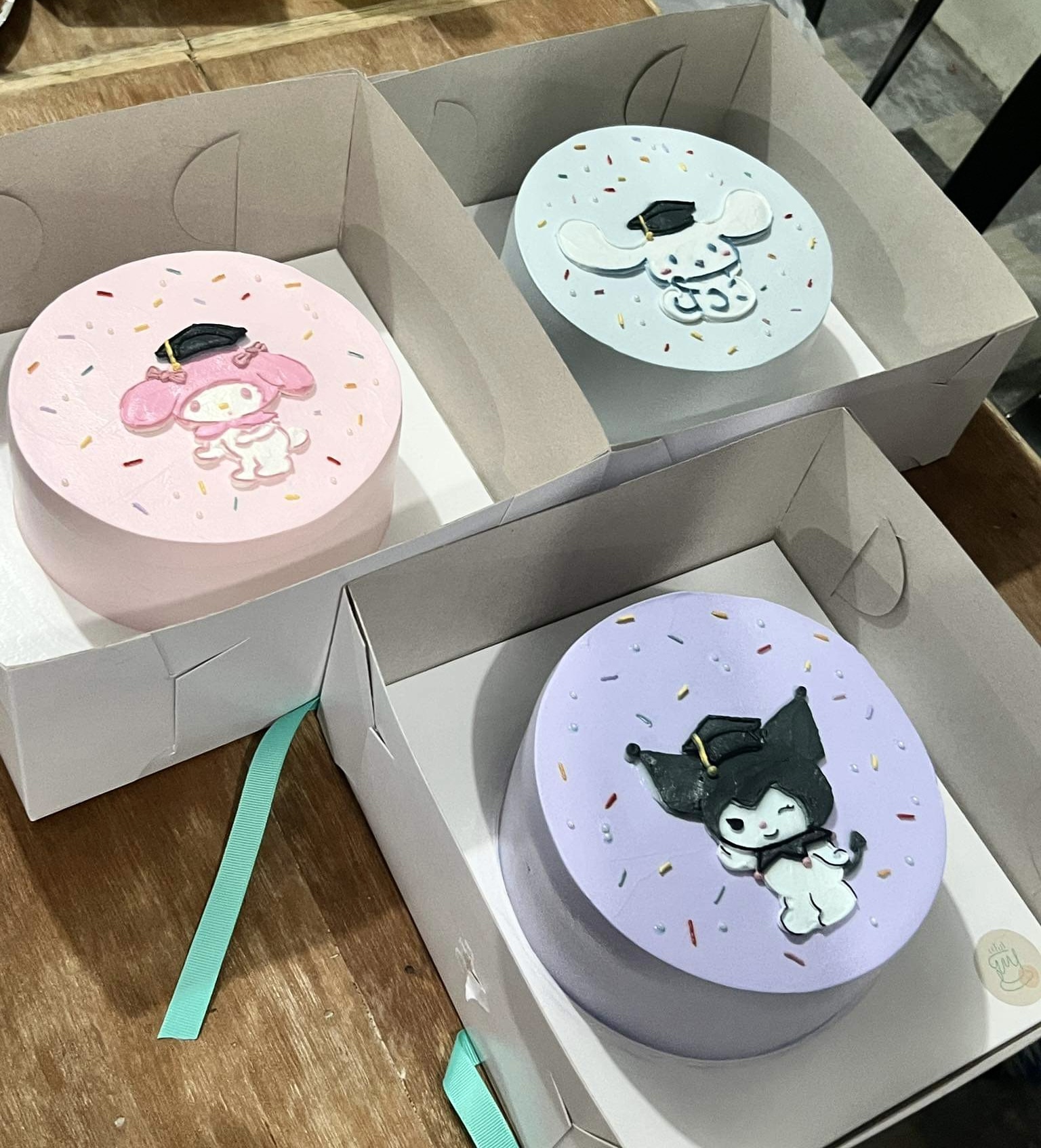 Sanrio (Kuromi, Cinamoroll, My Melody) graduation cakes by @caketales