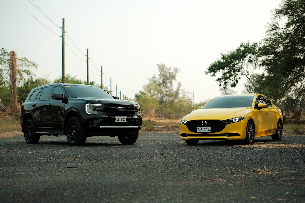 Mazda 3 yellow and Ford Everest