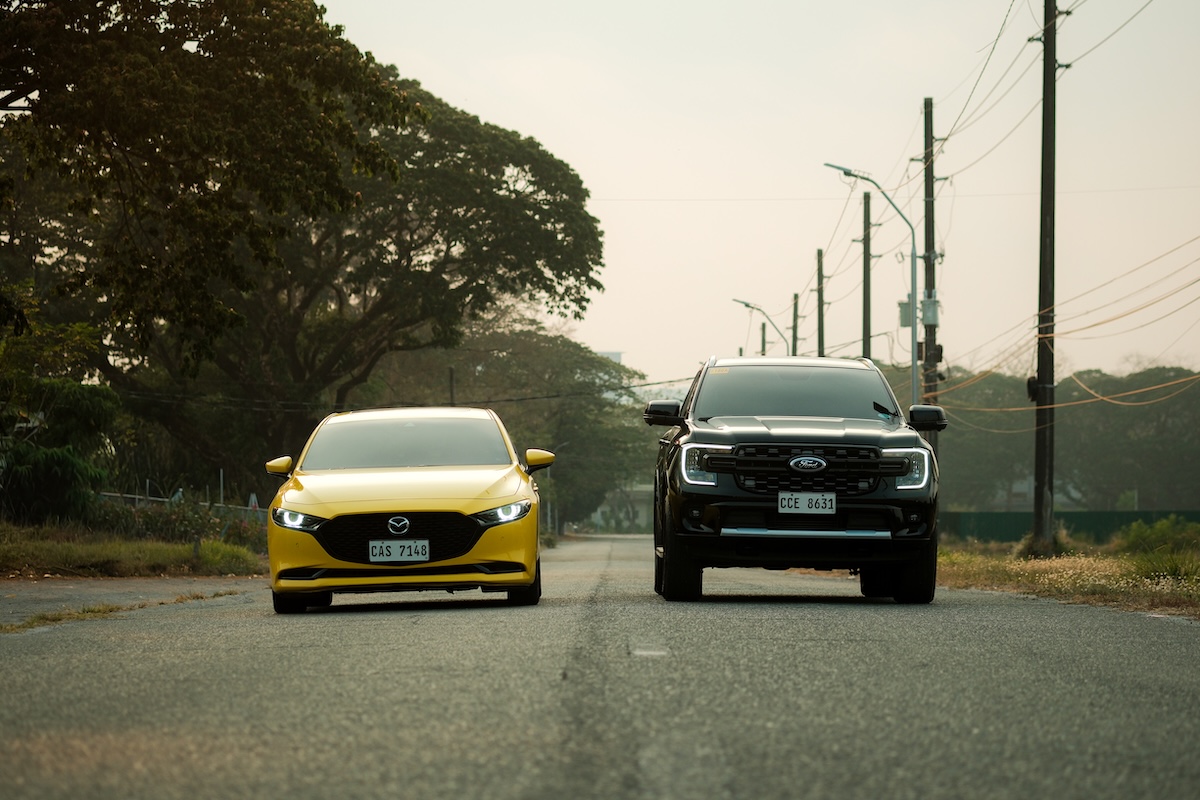 Mazda 3 yellow and Ford Everest