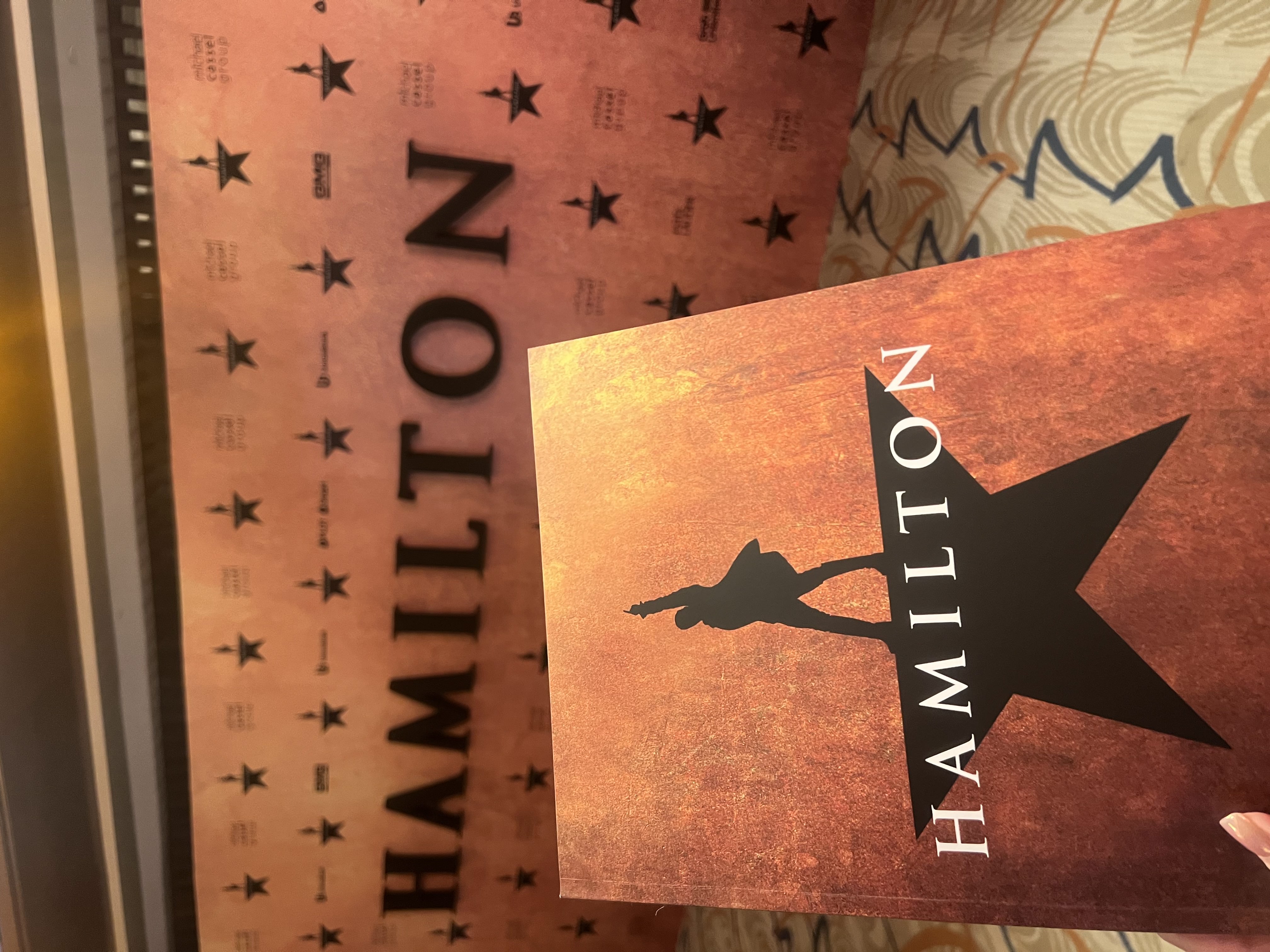 souvenir booklet + Hamilton backdrop