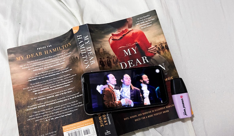 My Dear Hamilton book + Hamilton the Musical on a phone