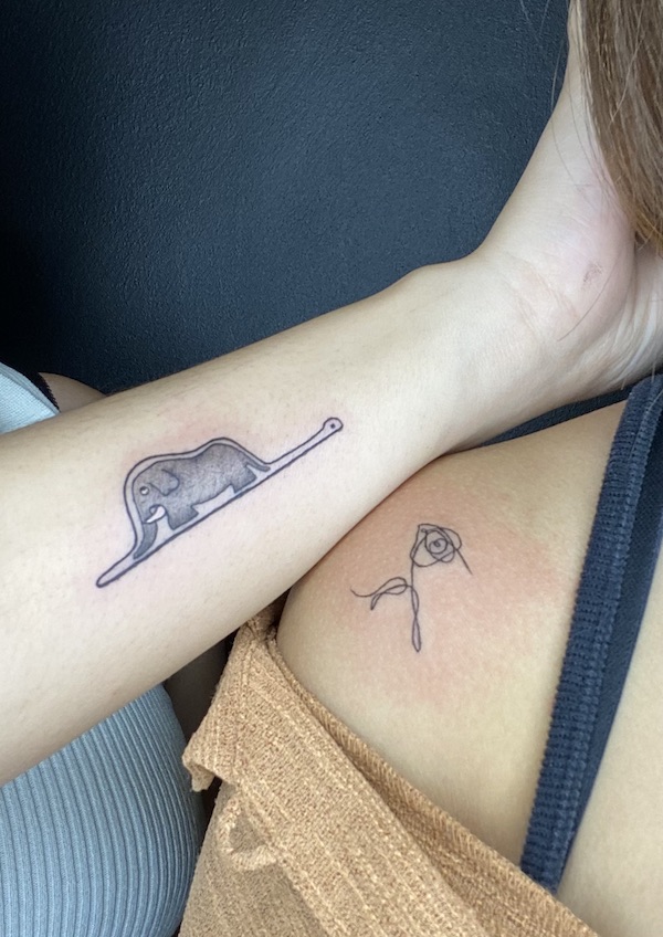 an elephant swallowed whole by a boa constrictor and rose (bts) tattoo
