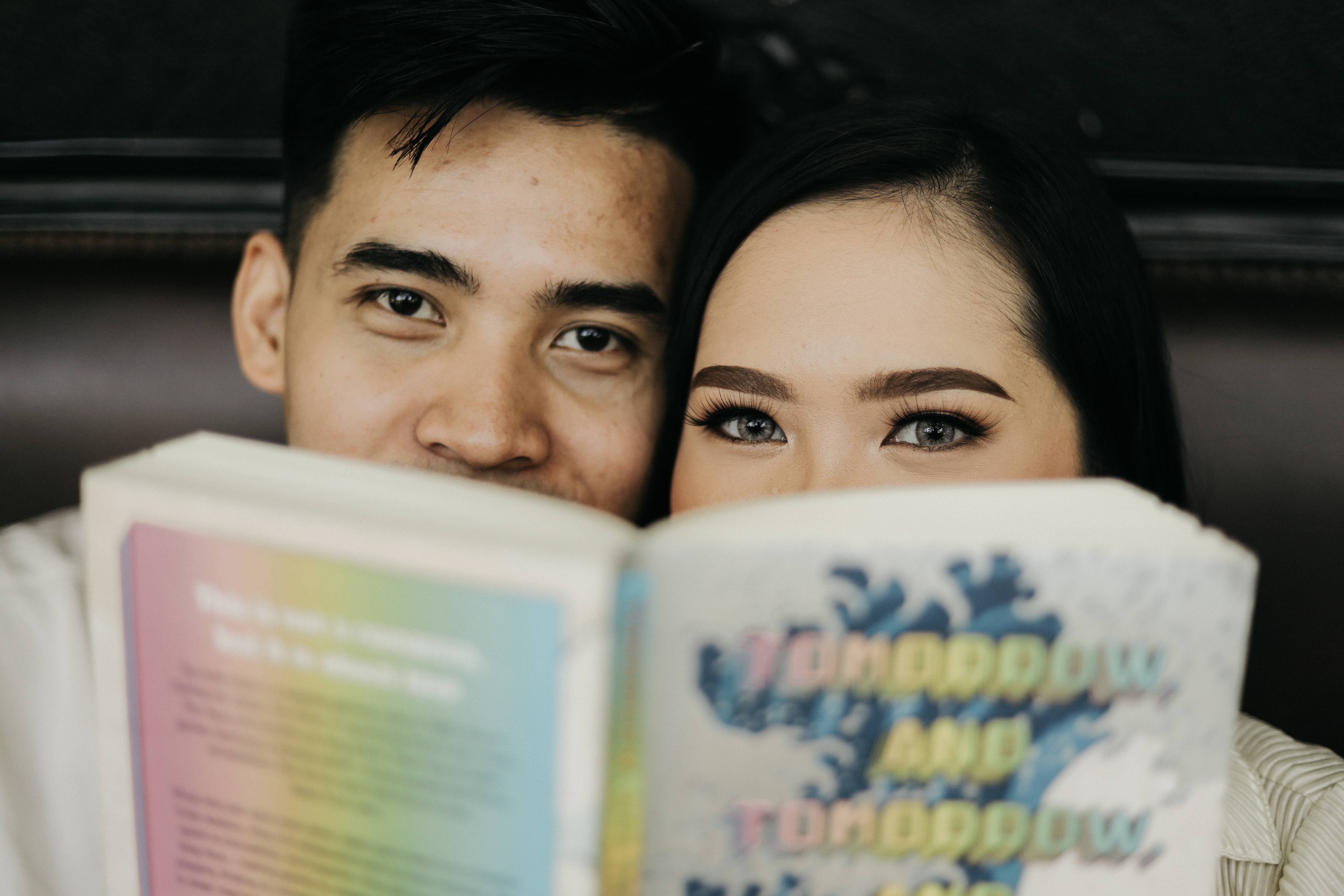 aj and kwe with a book